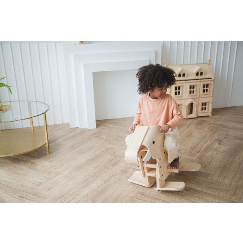 Kid playing PlanToys Walking Elephant