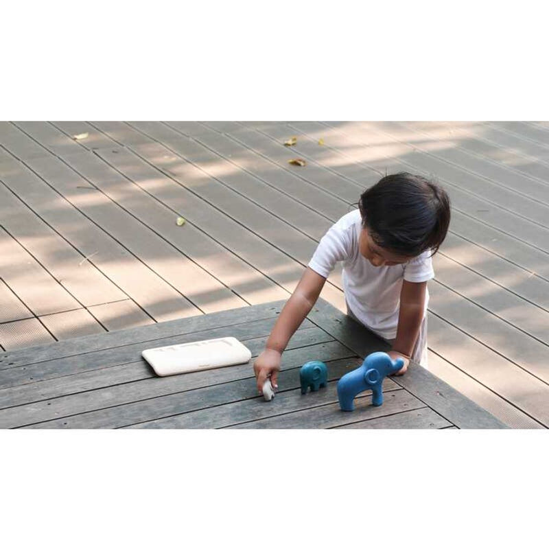 Kid playing PlanToys Elephant Puzzle