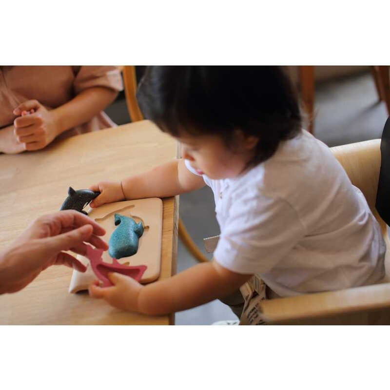 Kid playing PlanToys Sea Life Puzzle