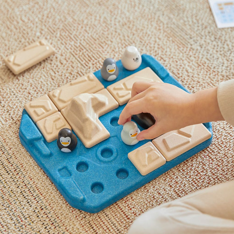 Kid playing PlanToys Finding Penguin Game