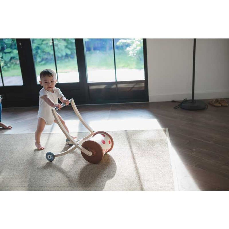 Kid playing PlanToys Roll N Walk