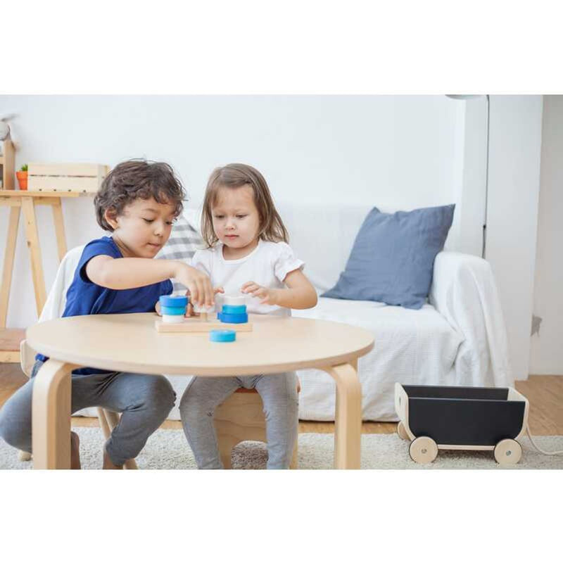 Kid playing PlanToys Trio Stacking