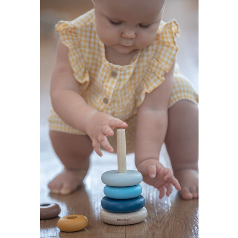 Kid playing PlanToys Stacking Ring - Orchard