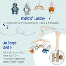 NOUKIE'S Musikalisches Mobile - Tiga, Stegi & Ops die Dinosaurier - Brahms Melodie - Kompatibel mit Wiege, Gitterbett und Laufstall - Ideal ab der Geburt zur Beruhigung des Babys