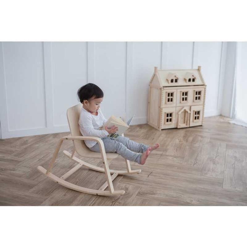 Kid using PlanToys Rocking Chair