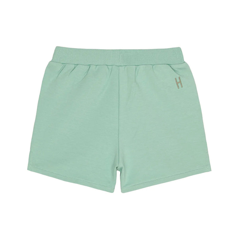 Little Hedonist organic cotton shorts with side pockets and splits for boys and girls in Neptune Green