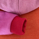 kronjuwel Kapuzenpullover Größe 98/104 aus 100% Merinowolle pink orange Upcycling
