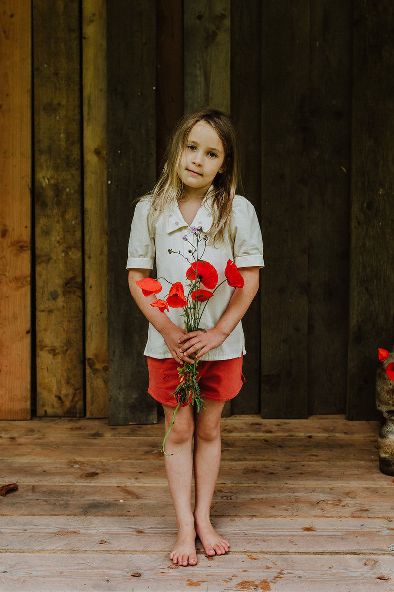 Little Hedonist puff sleeve blouse in Bleached Sand for girls. This button down shirt is made from organic cotton. Sustainable kids clothing.