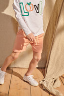 Enno shorts in grapefruit pink für Kinder