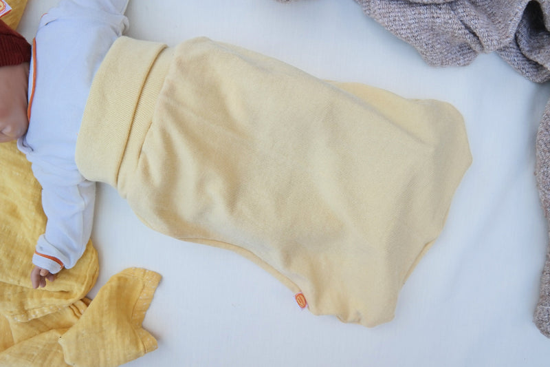 Lightweight summer romper sleeping bag for babies 0-6 months made from upcycled wool in pastel yellow