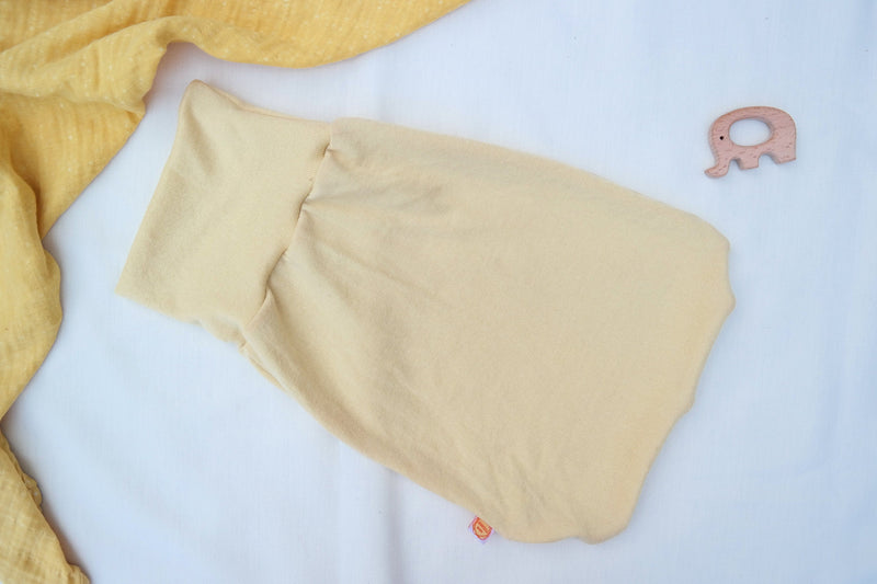 Lightweight summer romper sleeping bag for babies 0-6 months made from upcycled wool in pastel yellow