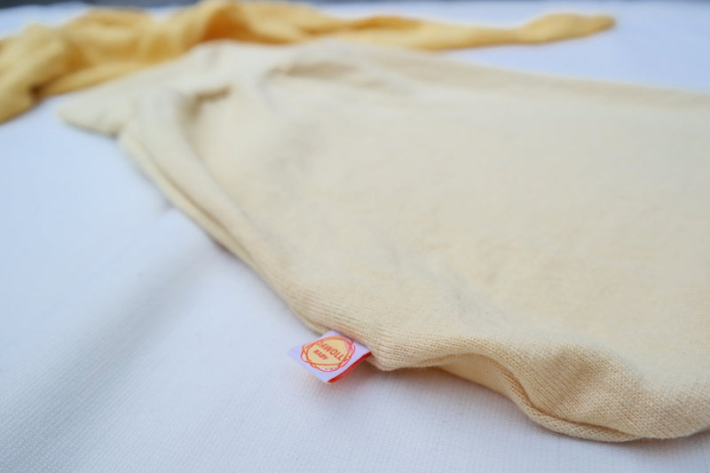 Lightweight summer romper sleeping bag for babies 0-6 months made from upcycled wool in pastel yellow