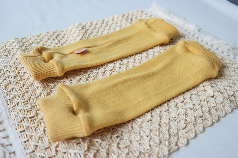 Leg warmers for babies 6-12M made of upcycled silk and cashmere in sunflower yellow