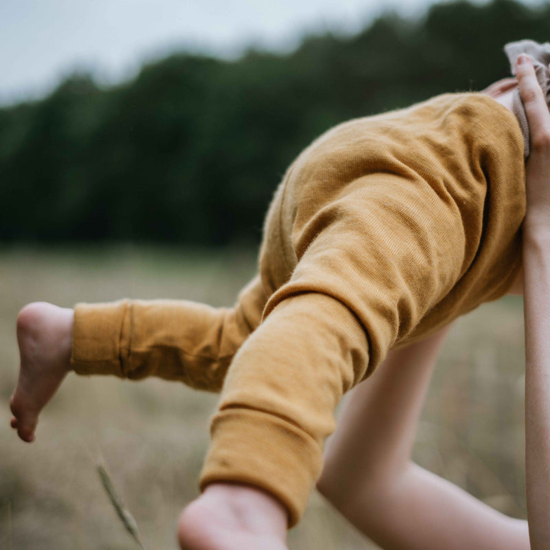 Mitwachs-Hose für Babys 62/68  aus Upcycling Wolle in Pfirsichgelb