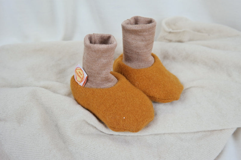 Warm baby shoes made from upcycled wool in mustard yellow &amp; beige