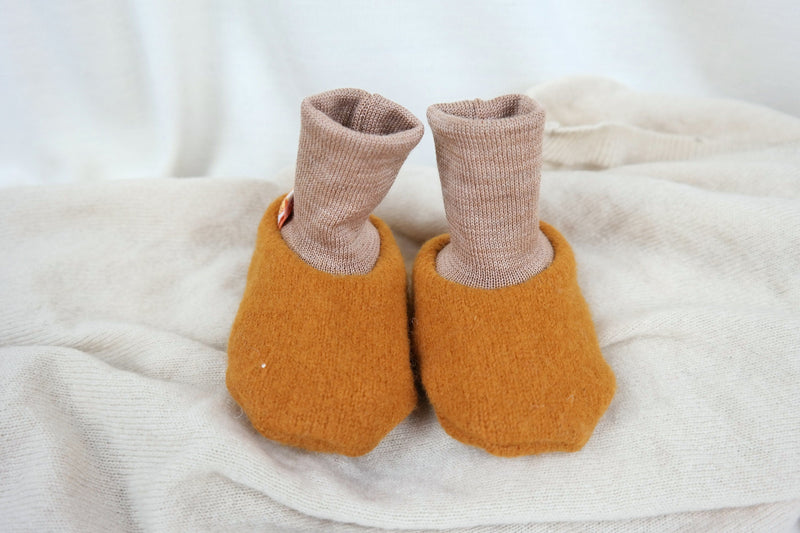 Warm baby shoes made from upcycled wool in mustard yellow &amp; beige