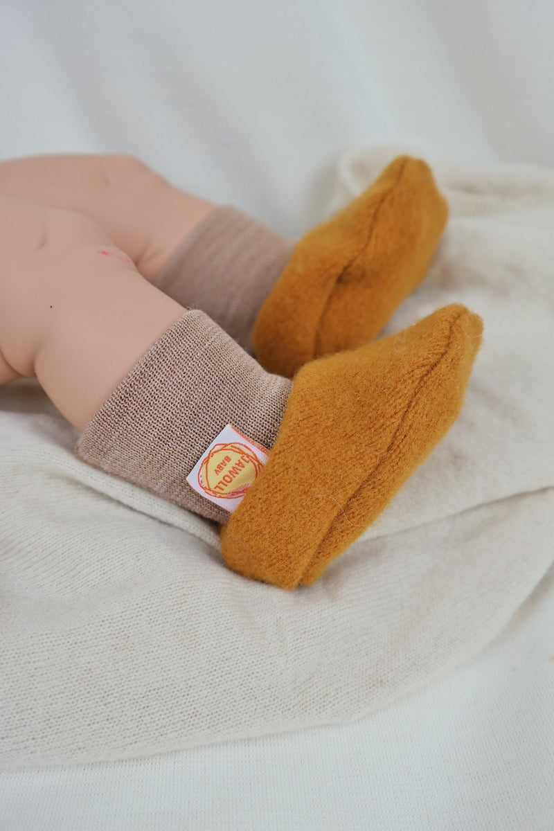 Warm baby shoes made from upcycled wool in mustard yellow &amp; beige