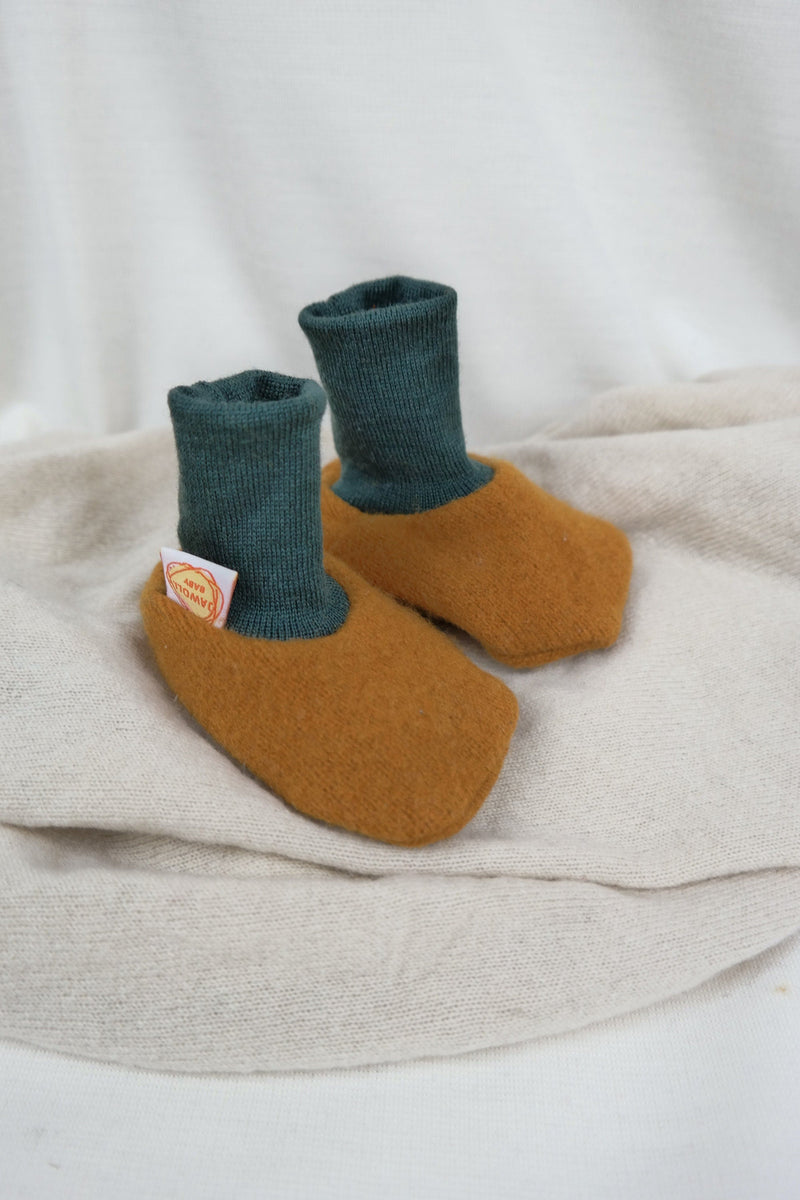 Warm baby shoes made from upcycled wool in mustard yellow &amp; dark green