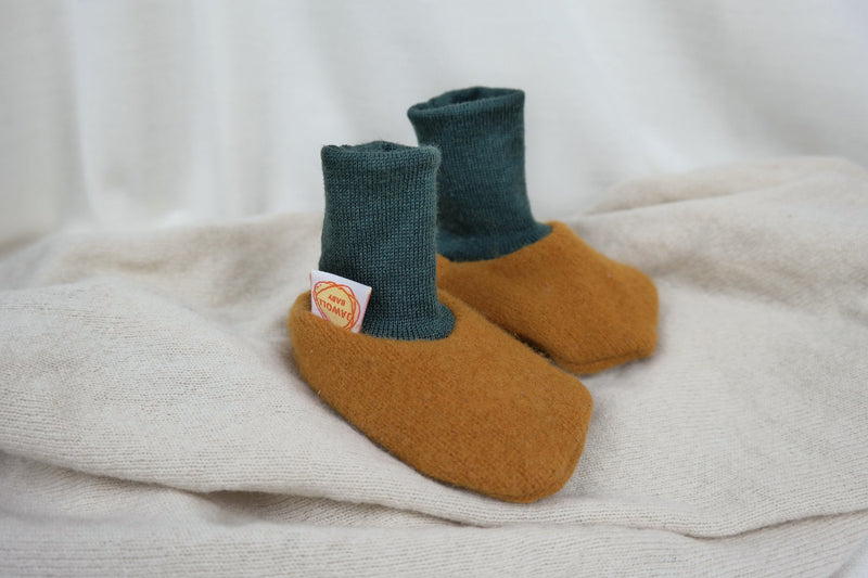 Warm baby shoes made from upcycled wool in mustard yellow &amp; dark green