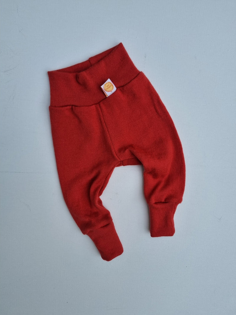 Growing pants for babies 50/56 made from upcycled merino wool in melon pink