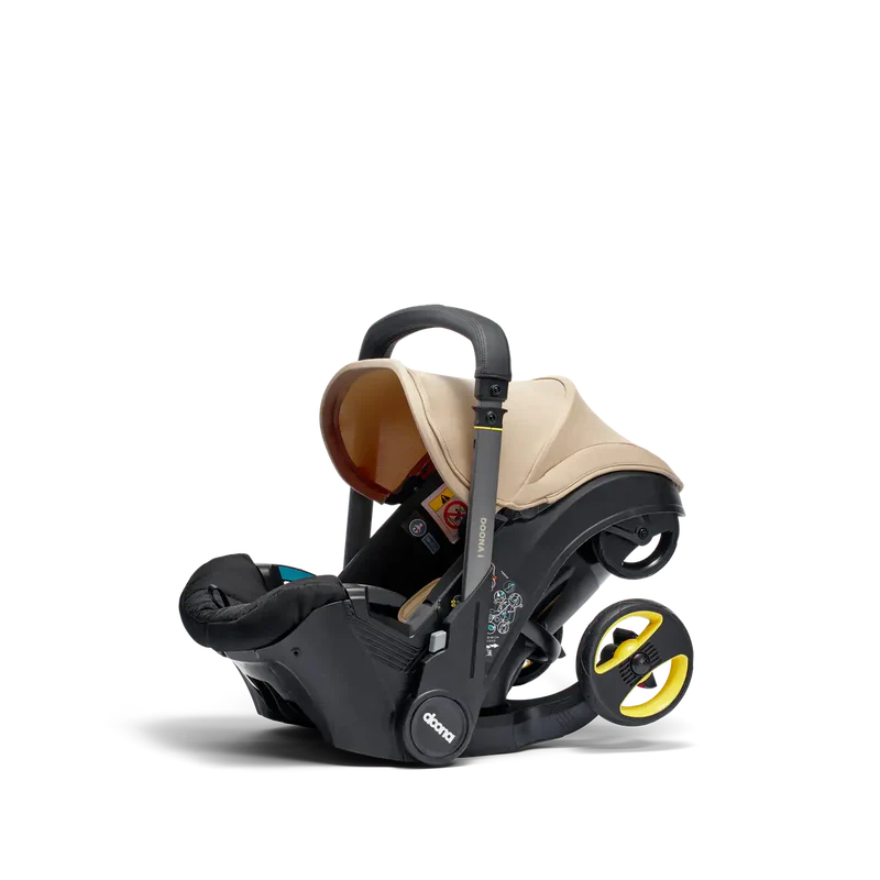 Doona i-Size Babyschale – i-Size Gruppe 0+ | 40–85 cm | 0–13 kg | Schwarz/Beige