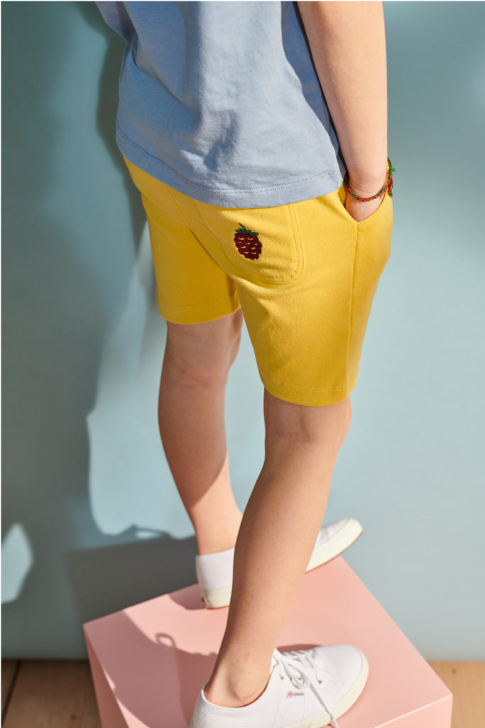 Enno shorts in mustard yellow with small blackberry embroidery for children