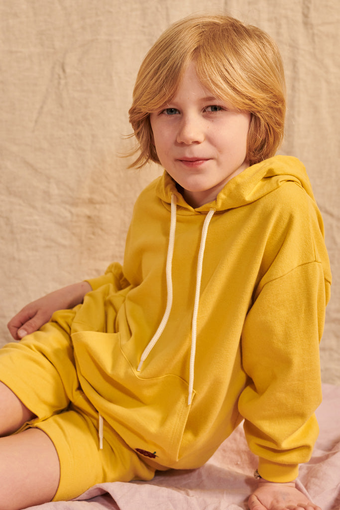 Lenzi Hoody in mustard yellow with small blackberry embroidery for children