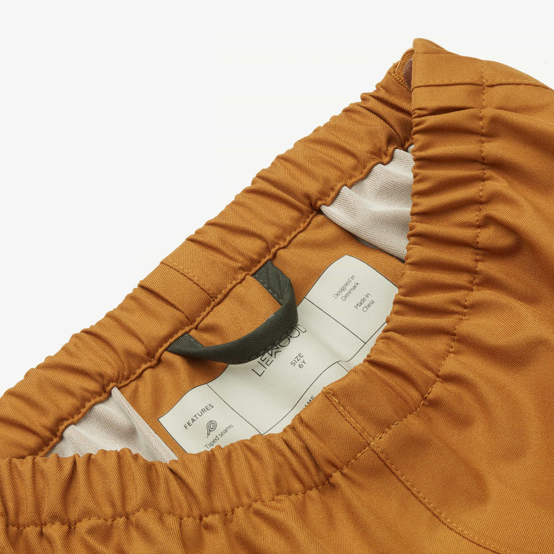 Rain jacket + pants set from Liewood in Mustard